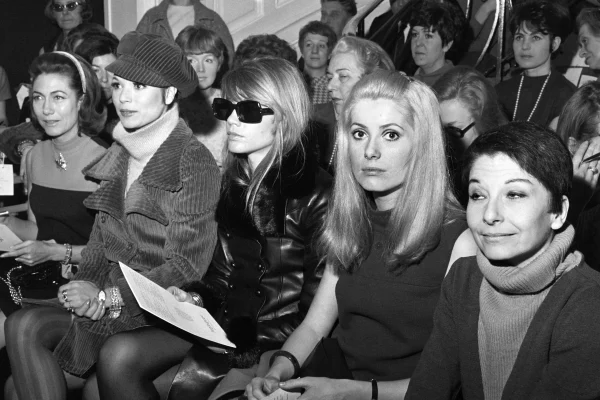 Italian actress Elsa Martinelli, French singer Francoise Hardy, French actress Catherine Deneuve and dancer Zizi Jeanmaire attend the Yves Saint Laurent spring/summer show